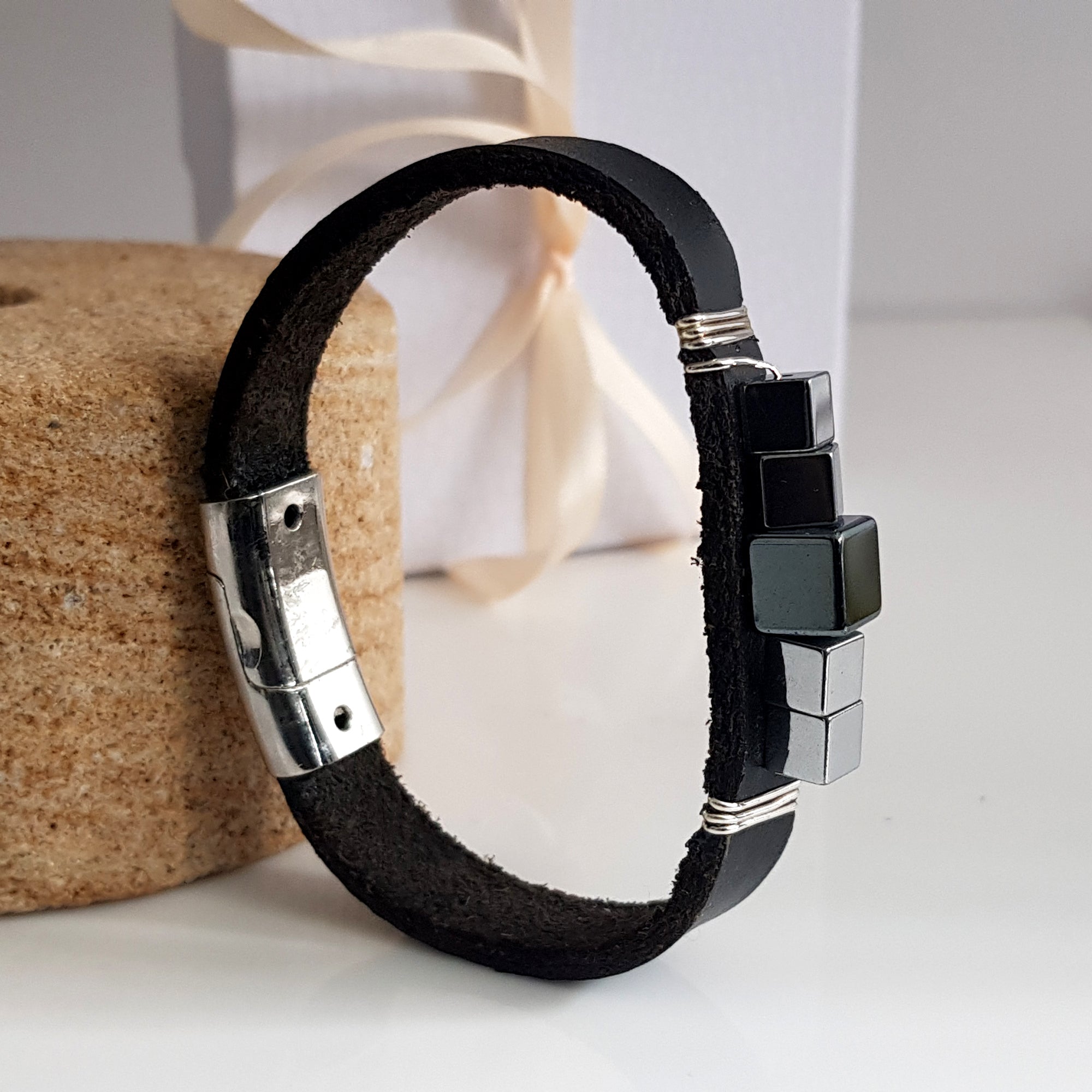 Large black leather and hematite band bracelet by Maroon Smudge, featuring a sleek, stylish design with metallic accents.
