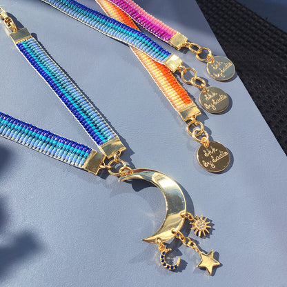 Yellow Athena Skinny Ombre Bracelet featuring blue, pink, and orange beads in a stylish, slim design.