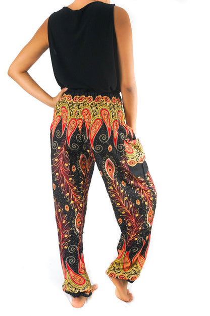 Black peacock boho gypsy pants by Tan Smokey featuring wide-leg style and intricate feather-inspired patterns.