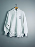 White hoodie from Emerald Ourea with "Dear Person Behind Me" text, casual sweater hoodie with front pocket and drawstrings.