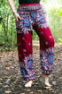 Burgundy floral mandala boho pants for women by Tan Smokey, featuring a relaxed fit and vibrant floral design for yoga and casual wear.