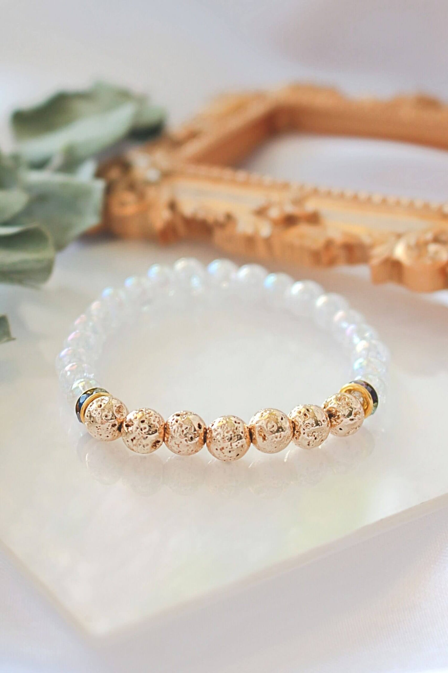 Golden Lava Stone aroma diffuser bracelet by Ultramarine Birch featuring elastic band and round lava stone beads.