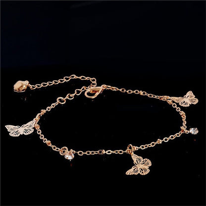 Silver plated butterfly Bohemia ankle bracelet with chain design from Red Iphigenia, styled as a fashionable accessory.