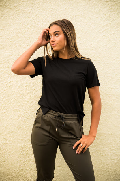 Black DT Alyssa Rib Knit Split Hem Tee by Lavender Danae, featuring ribbed fabric and stylish split hem detail.