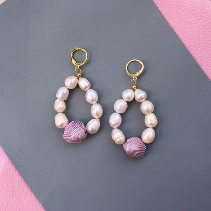 Yellow Athena Candy Shell Pearl Earrings featuring smooth, round pearl drops with a glossy candy shell finish, stylish and elegant.