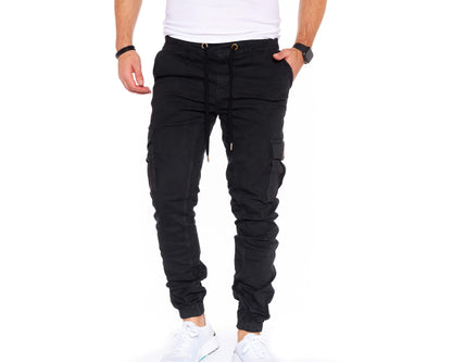 Carmine Nesoi Styleko cargo pants with elastic waistband, featuring multiple pockets and rugged design for casual wear.