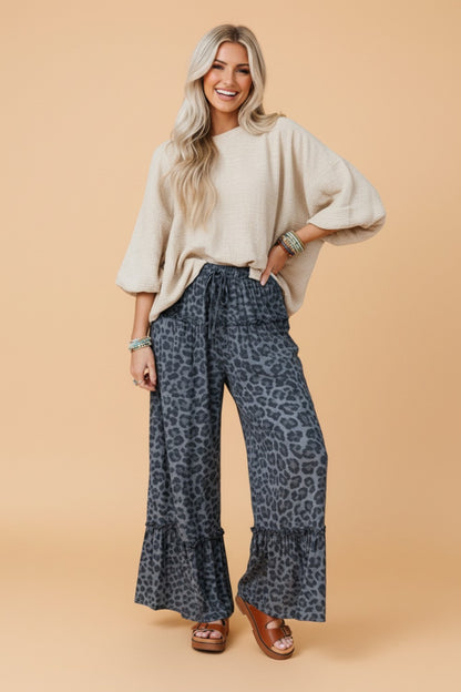 Leopard print frilled drawstring waist wide-leg pants for women by Byzantium Bay, showcasing the relaxed fit and stylish design.