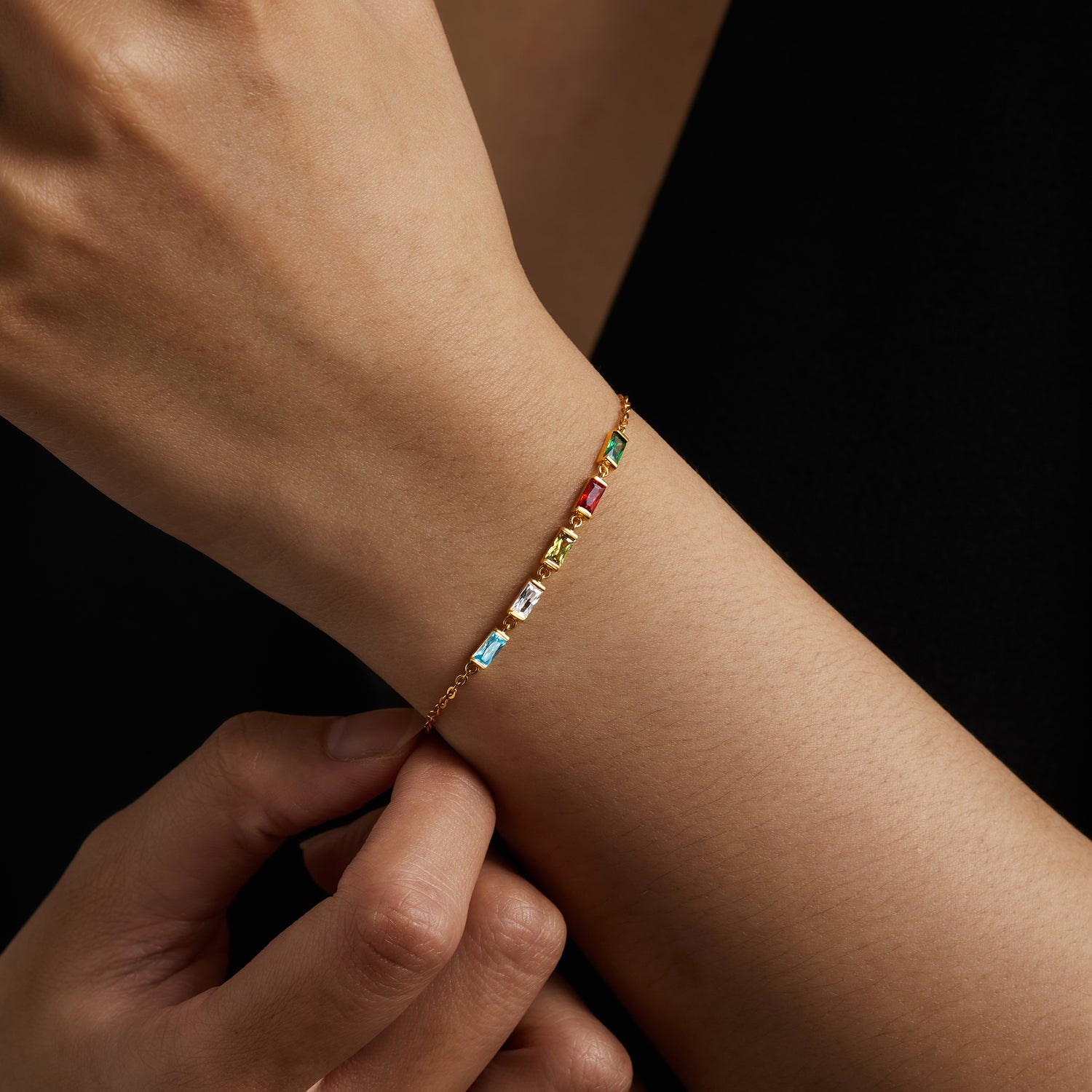 Green Millie mom bracelet with colorful birthstone charms and delicate chain, stylish and meaningful jewelry accessory.