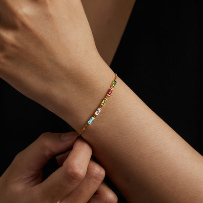 Green Millie mom bracelet with colorful birthstone charms and delicate chain, stylish and meaningful jewelry accessory.