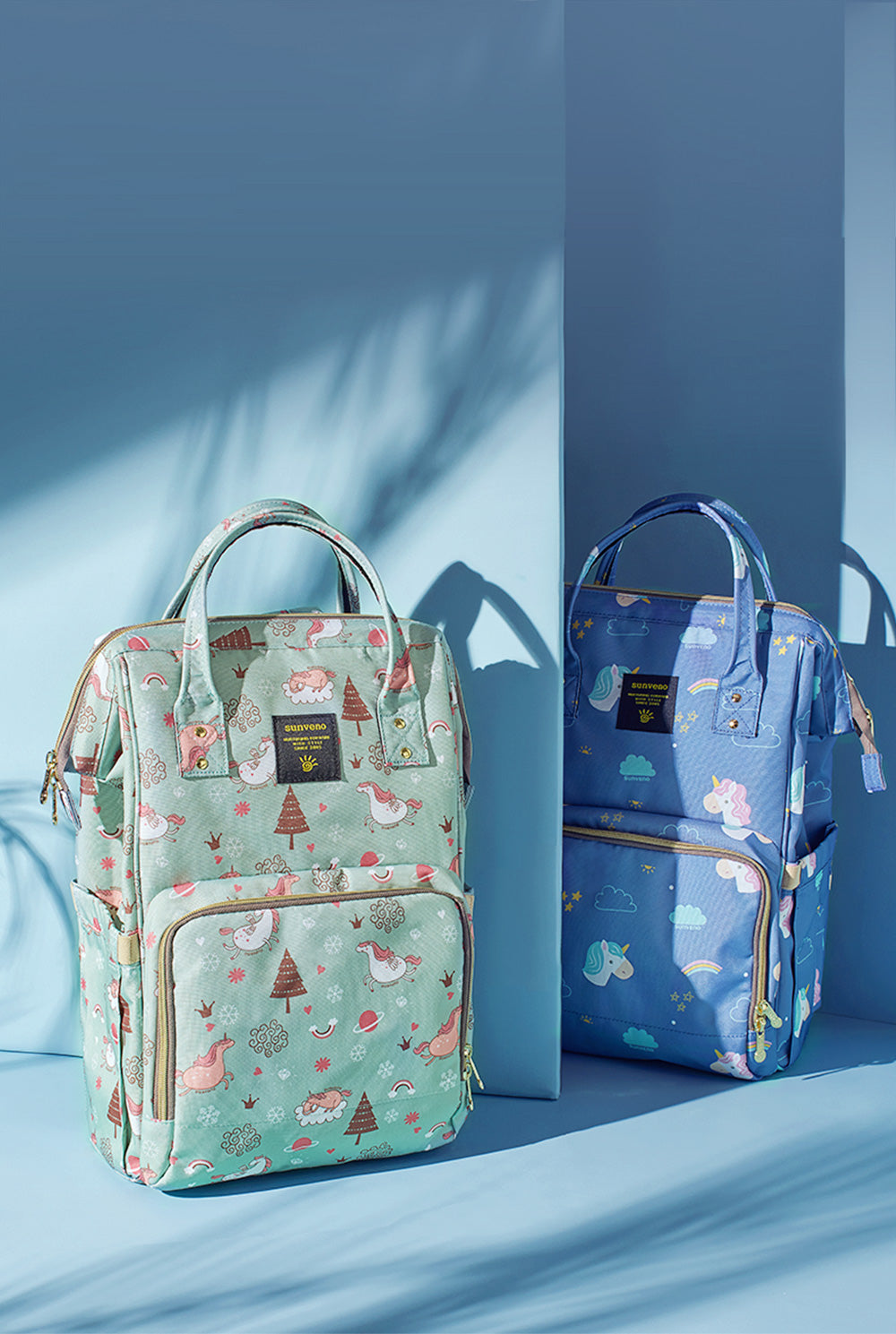 Maroon Chronos fish-opening diaper bag unicorn backpack with colorful design, multiple compartments, and adjustable straps.