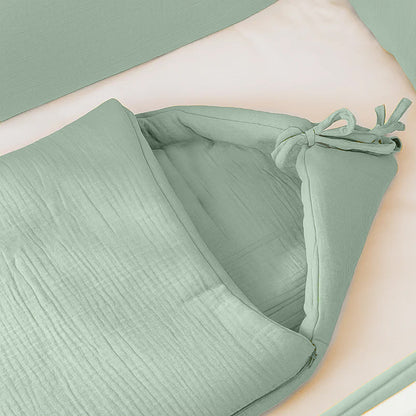 Organic cotton bunting bag in green for kids and babies by Chocolate Briseis, featuring soft fabric and playful design.
