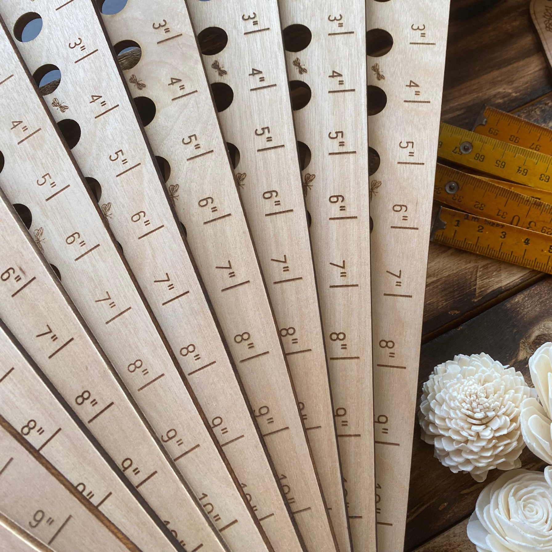 Cerise Almond Butterfly Garden Seed Spacing Ruler showing measurement marks for planting seeds accurately in a garden.