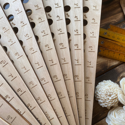 Cerise Almond Butterfly Garden Seed Spacing Ruler showing measurement marks for planting seeds accurately in a garden.