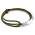 Khaki green Hove silver and rope bracelet by Magenta Sooty with woven rope detail and silver accents, close-up view of the bracelet.