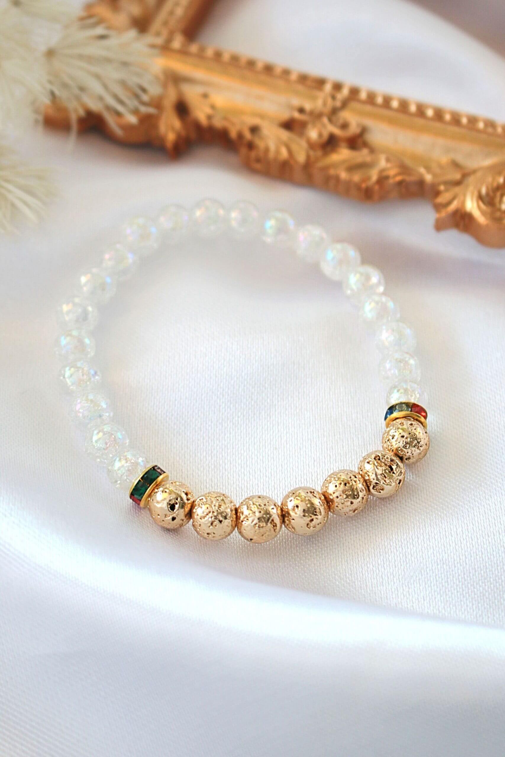 Golden lava stone elastic bracelet with aroma diffuser beads, featuring a sleek design by Ultramarine Birch.