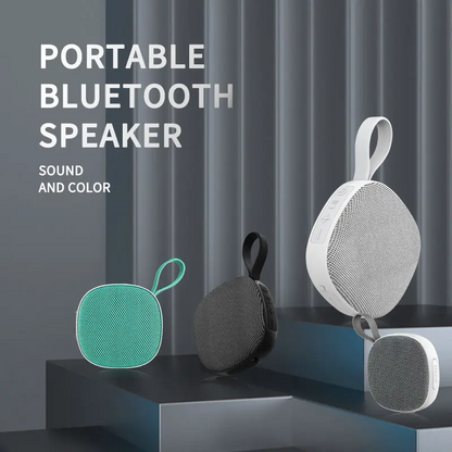 Lilac Milo waterproof portable mini TWS Bluetooth speaker showing compact design and control buttons in a close-up shot