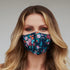 Turquoise floral face mask for women by Cyan Poppy, featuring a vibrant floral pattern and comfortable fabric.