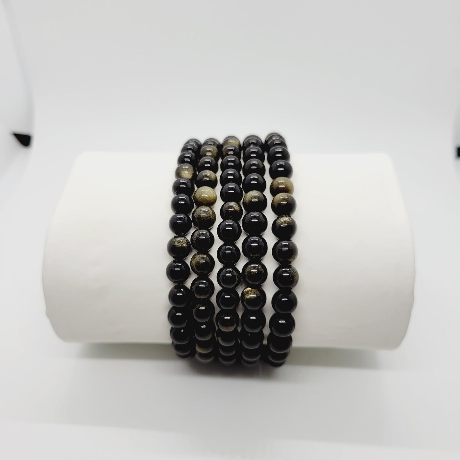 Gold sheen Obsidian stone bracelet by Olive Coeus featuring natural beads with a subtle metallic gold glow, perfect for boho and metaphysical styling.