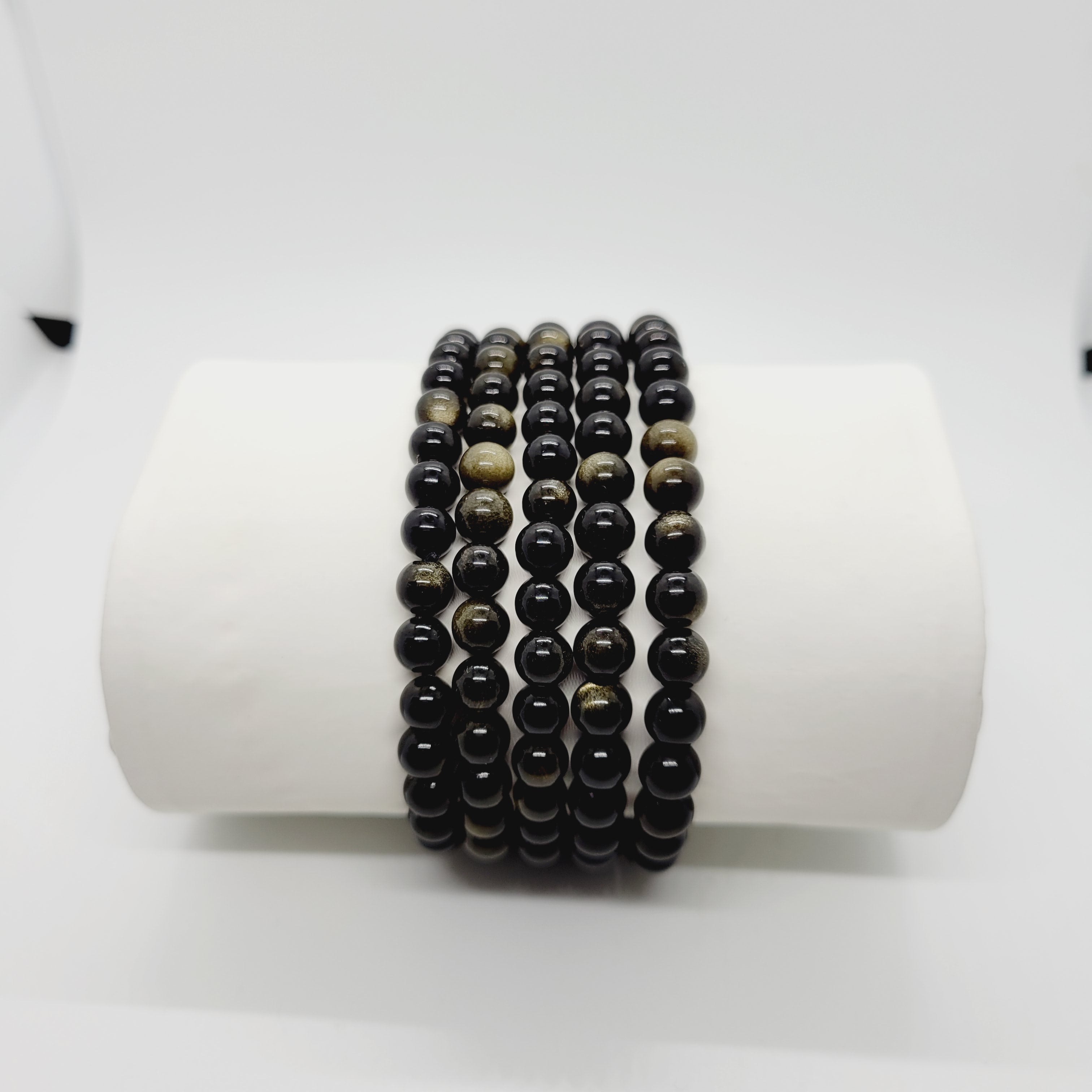 Gold sheen Obsidian stone bracelet by Olive Coeus featuring natural beads with a subtle metallic gold glow, perfect for boho and metaphysical styling.
