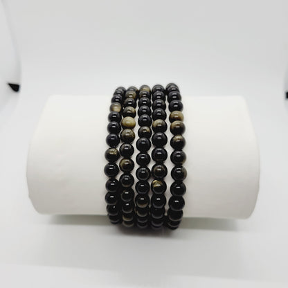 Gold sheen Obsidian stone bracelet by Olive Coeus featuring natural beads with a subtle metallic gold glow, perfect for boho and metaphysical styling.