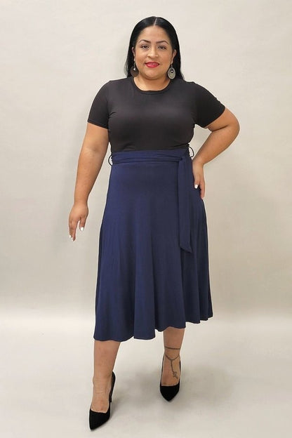 Burgundy Daisy high waist midi skirt with waist tie, solid color, flowing fabric, and stylish design for women.