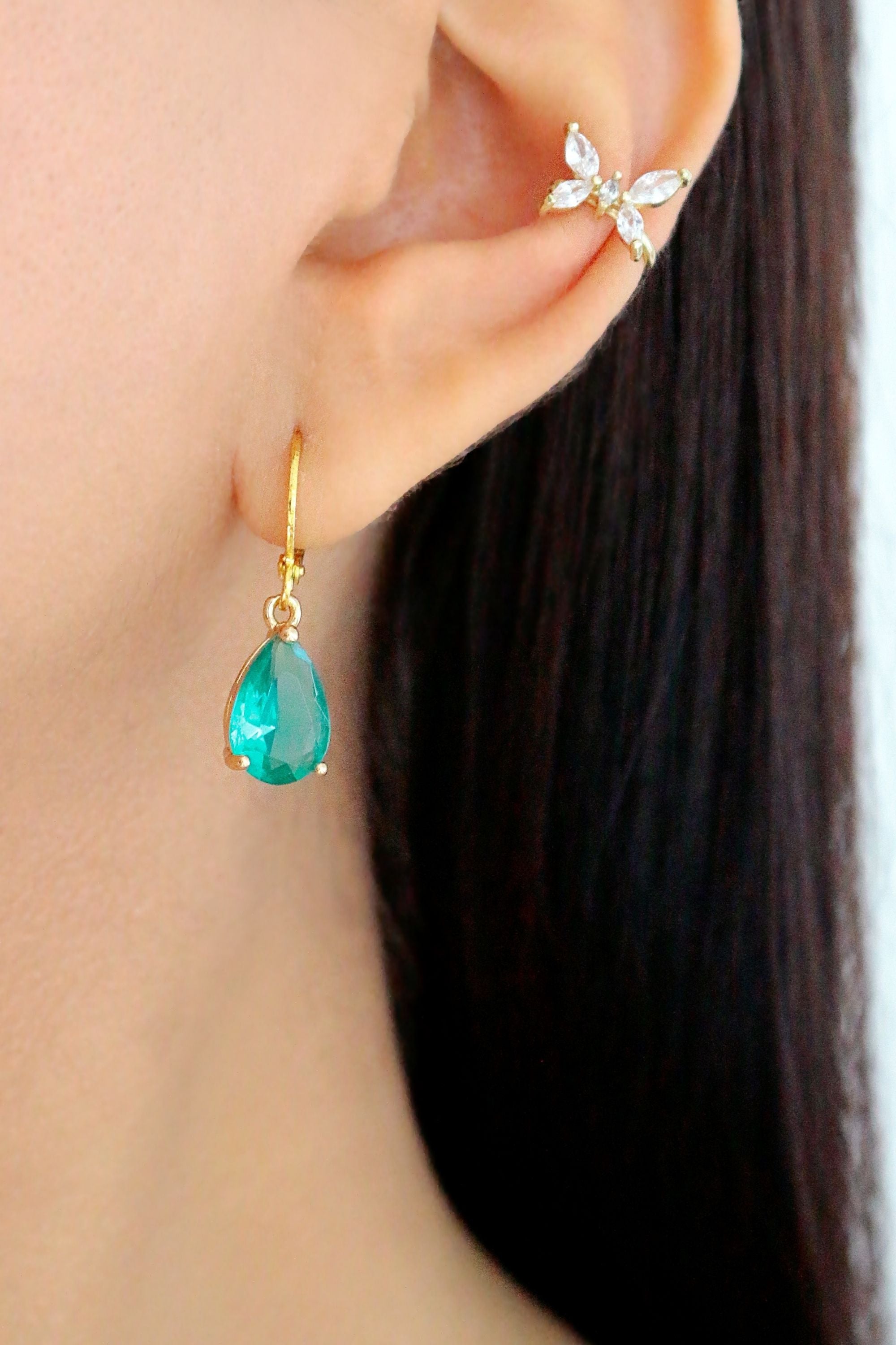 Ultramarine Birch 18K rainbow teardrop hoop earrings with vibrant multicolor gemstone accents and gold hoop design.