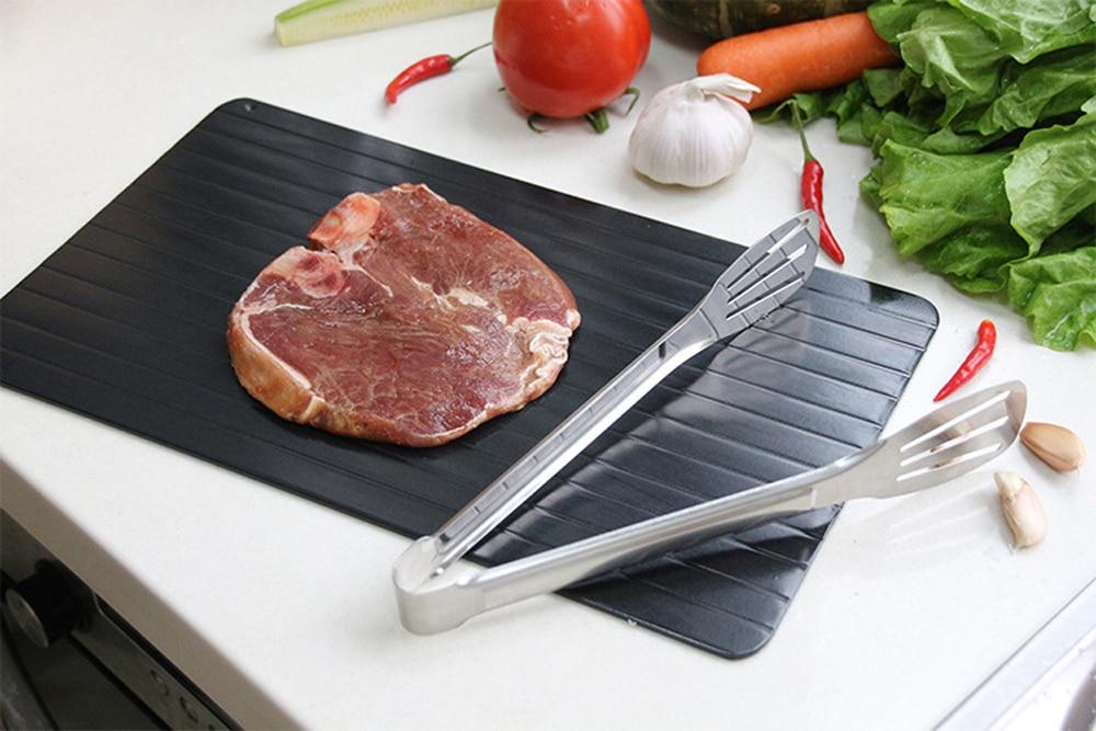 Yellow Pandora fast defrosting food tray for meat and seafood, kitchen tool for quick thawing of frozen items.