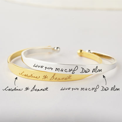 Green Millie handwritten cuff bracelet cufflinks with elegant, artistic design in silver tone, showcasing intricate engraved details.