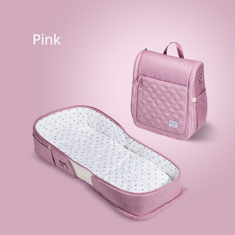 Foldable Teal Simba baby portable bed bag with travel crib and carry-on nest bed for newborns, shown in a compact, lightweight design.