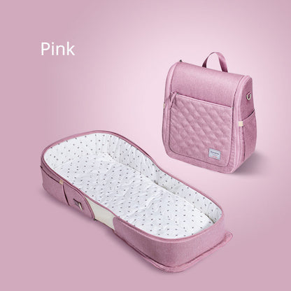 Foldable Teal Simba baby portable bed bag with travel crib and carry-on nest bed for newborns, shown in a compact, lightweight design.