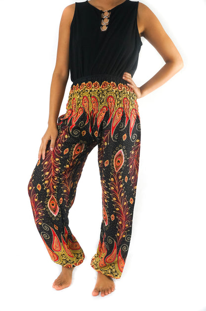 Black peacock boho hippie gypsy pants by Tan Smokey featuring flowy fabric and intricate feather-inspired patterns.