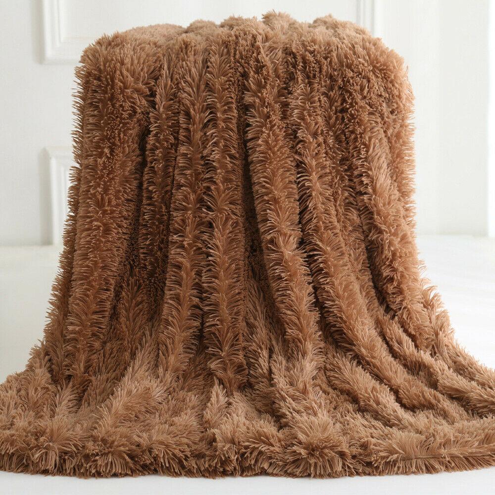 Yellow Pandora ultra soft faux fur throw blanket draped over a sofa, showcasing plush texture and cozy home decor.