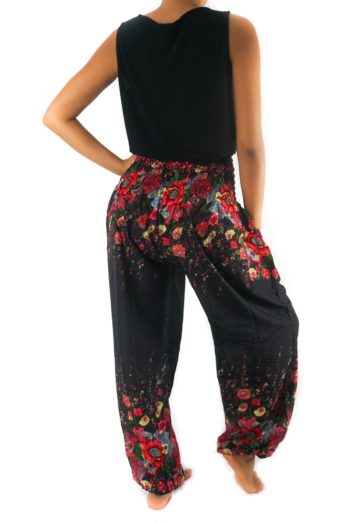 Black boho floral yoga pants for women, featuring a loose fit and hippie style from Tan Smokey.