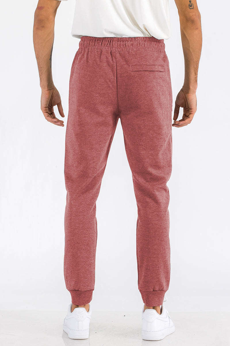 Light gray Heathered Cotton Sweats for men by Lime Milo, showing the comfortable, casual fit and soft fabric detail.