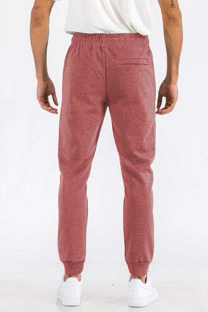Light gray Heathered Cotton Sweats for men by Lime Milo, showing the comfortable, casual fit and soft fabric detail.