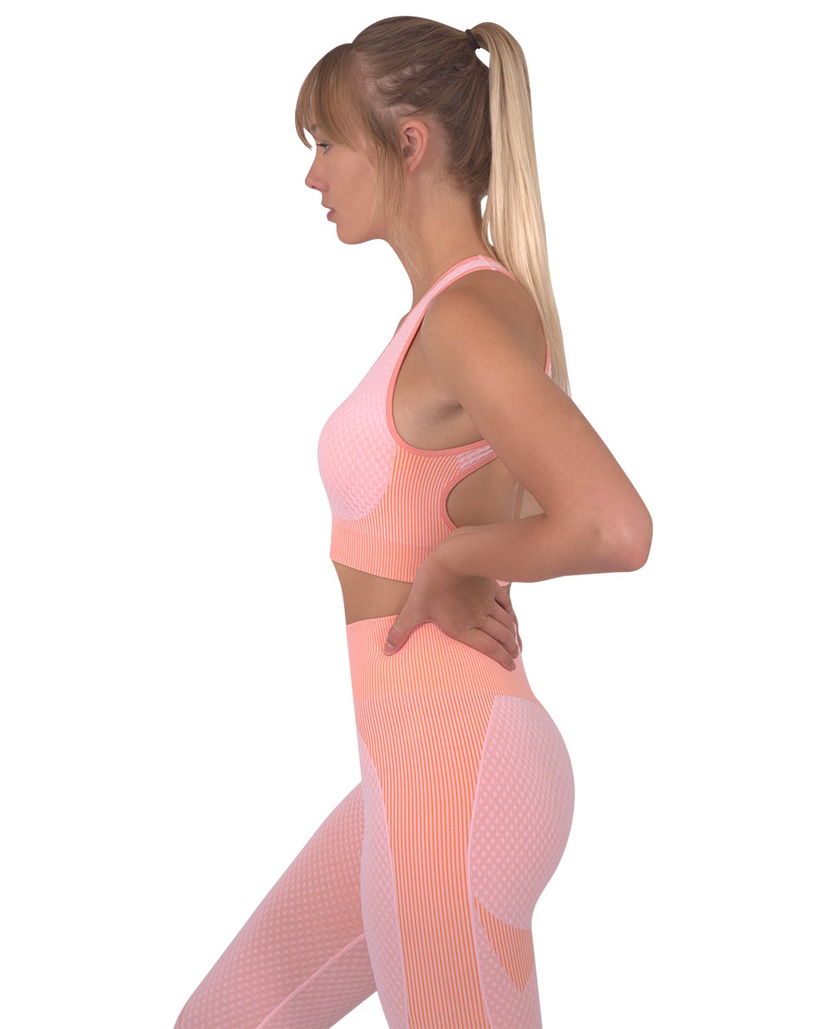 Lazurite Trois seamless pink sports bra for activewear, shown on a mannequin with supportive design and smooth fabric.