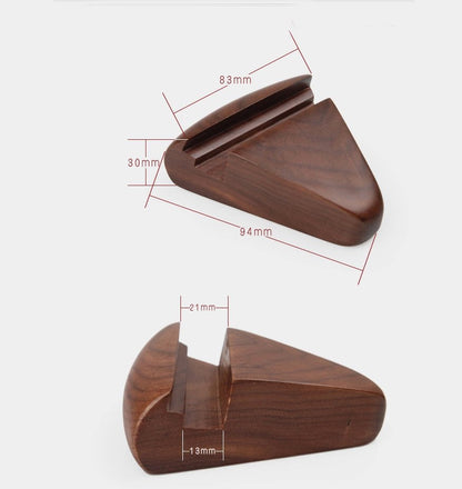 Fuchsia Molly walnut phone stand for home and garden, showcasing a sleek wooden holder for smartphones on a clean surface.
