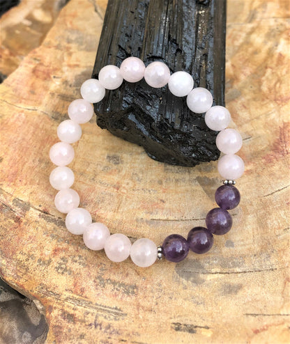 Rose Quartz and Amethyst stretch bracelet by Violet Chaos featuring natural crystal beads on a clear elastic cord.