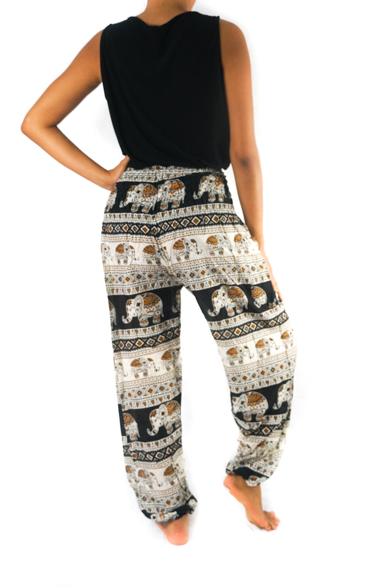 Black Elephant print boho pants for women by Tan Smokey, featuring a relaxed fit, hippie style, and comfortable yoga-inspired design.