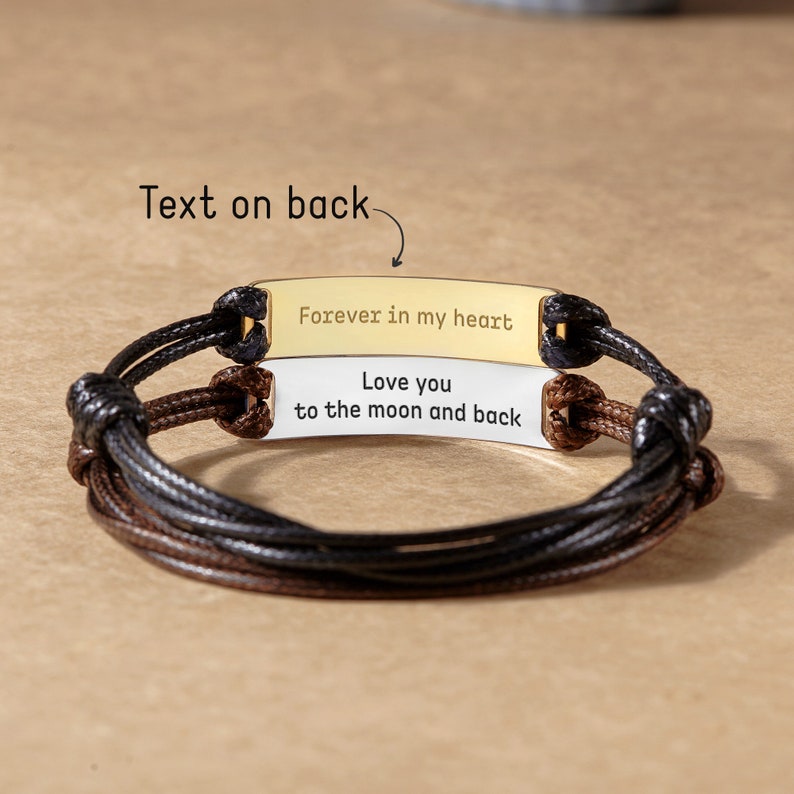 Green Millie fingerprint handwriting bracelet for men, close-up of engraved personalized writing on stylish bracelet.