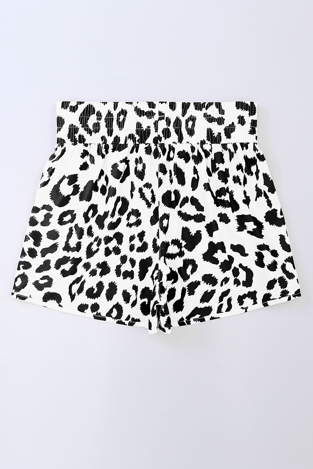 Byzantium Bay leopard and checker high waist athletic shorts displayed on a model, showcasing bold print and comfortable fit.