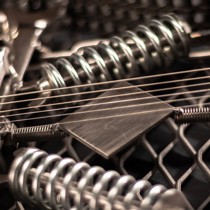 Metal electric guitar sculpture wall art by Turquoise Poppy, heavy metal home decor piece showcasing a detailed guitar design.