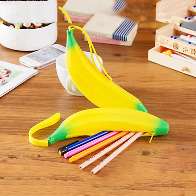 Fuchsia Molly banana design wallet with yellow banana print, compact and stylish accessory for everyday use.
