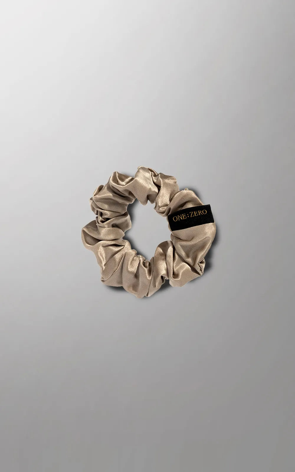 Silk hair ties in gray, golden, and white from Burgundy Clover, featuring M and L sizes, displayed on a neutral background.