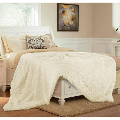 Yellow Pandora ultra soft faux fur throw blanket spread on a cozy living room sofa, showcasing plush texture and warm comfort.
