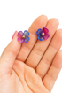 Apricot Perses 2-in-1 earrings featuring a purple flower charm and gold stud for versatile jewelry style.
