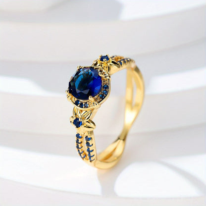 Carmine Medusa sapphire ring featuring a vibrant blue sapphire gemstone set in a silver band with intricate design details.