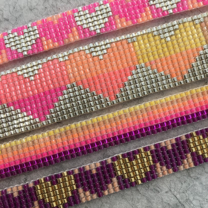 Colorful Rainbow Heart Bracelets by Yellow Athena featuring vibrant rainbow beads and heart charms on stretchy elastic band