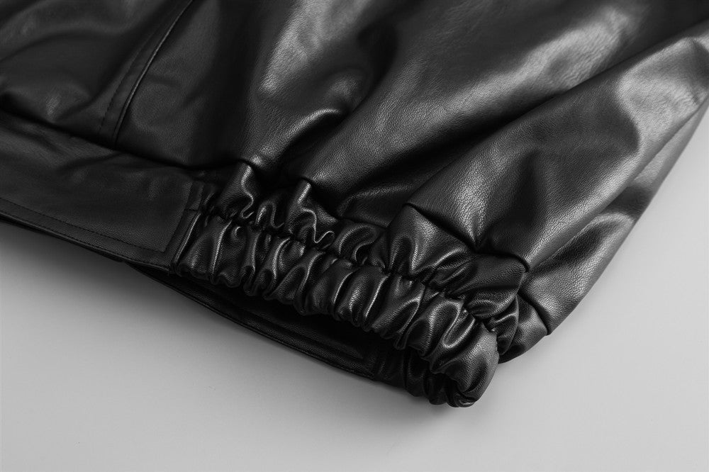 Black Drive Moto Jacket by Carmine Juneberry, Haute Edition 25, featuring a sleek motorcycle jacket design with stylish details.