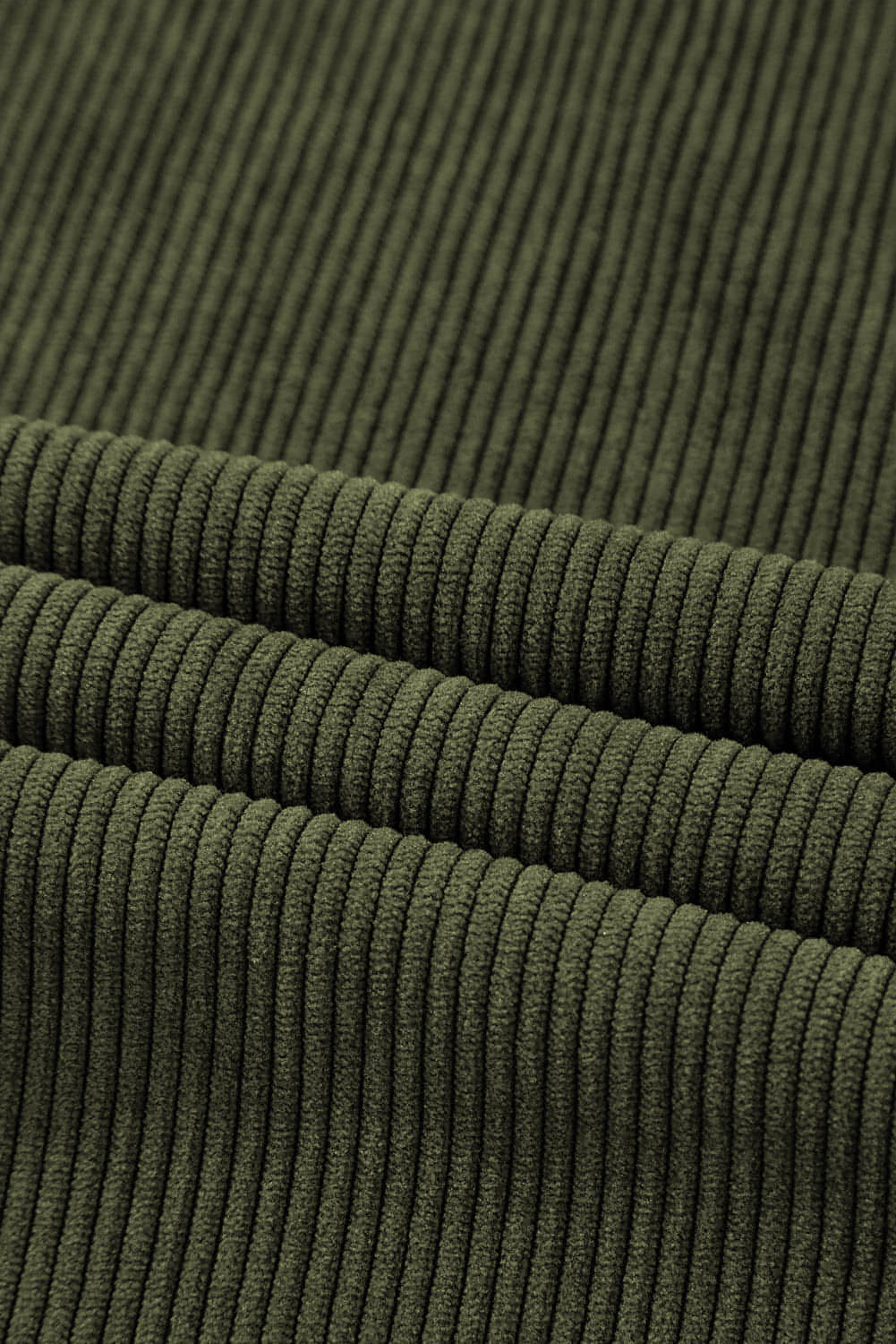 Green high waist corduroy pants with square pockets by Carmine Juneberry, showcasing a stylish, fitted design.